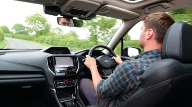 Auto Express staff writer Alastair Crooks driving the 2023 Subaru Forester
