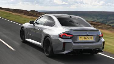 New BMW M2 being driven in the UK - rear action 