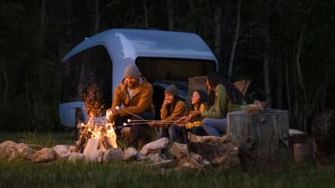 People sitting around a bonfire