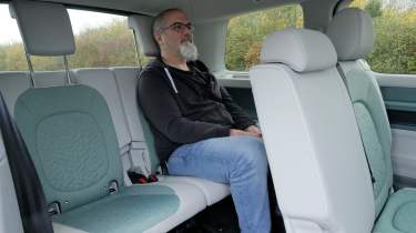 Auto Express senior road test editor Dean Gibson sitting in the Volkswagen ID. Buzz LWB&#039;s back seat