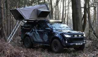 Isuzu D-Max Basecamp - pick-up parked with roof tent open, front 