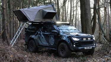 Isuzu D-Max Basecamp - pick-up parked with roof tent open, front 