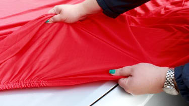 Indoor car cover being fitted