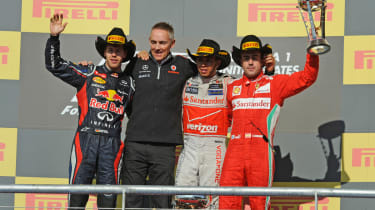 Sebastian Vettel, Martin Whitmarsh, Lewis Hamilton and Fernando Alonso on the podium