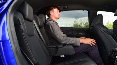 Auto Express senior news reporter Alastair Crooks sitting in back seat of Lexus RX 500h