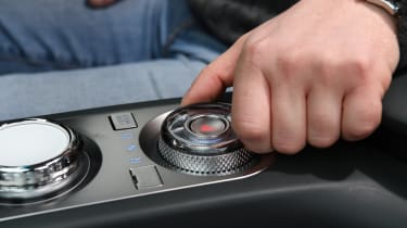 Auto Express chief reviewer Alex Ingram operating Genesis Electrified GV70&#039;s gear selector