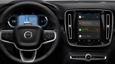 Volvo dashboard with infotainment screen displaying Apple CarPlay widgets