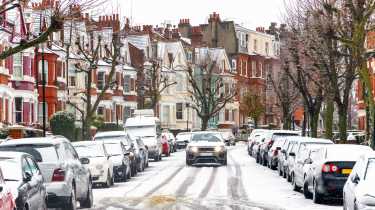 Urban street covered in snow and ice