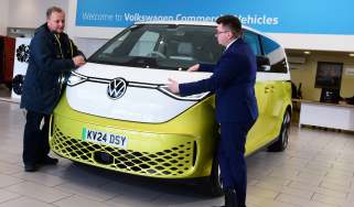 Auto Express editor-in-chief Steve Fowler leaning on the Volkswagen ID. Buzz with Volkswagen sales executive Tom Lodge 