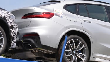 New BMW X4 spied uncovered rear quarter