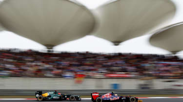 Jean-Eric Vergne ahead of Heikki Kovalainen