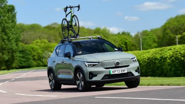 Volvo XC40 cornering with bike attached to roof-rack