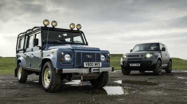 Land Rover Defender Classic V8 parked next to a modern Land Rover Defender V8