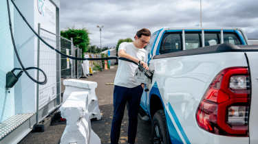 Auto Express consumer reporter filling up the hydrogen powered Toyota Hilux