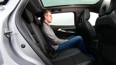 Auto Express associate editor Sean Carson sitting in the back seat of the Renault Austral
