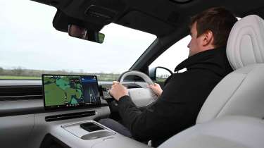 XPeng G6 - interior driving shot with Senior news reporter, Alastair Crooks