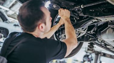 Mechanic working on car