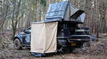 Isuzu D-Max Basecamp - pick-up parked with roof tent open