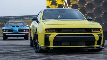 New Dodge Charger Super Bee Launch Edition - front static with classic Super Bee in the background