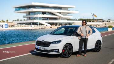 Auto Express senior staff writer Jordan Katsianis standing next to the Skoda Fabia 130