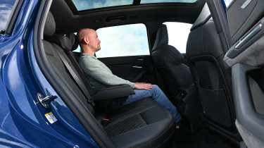 Audi Q6 e-tron - rear seats being sat in by Auto Express chief reviewer Alex Ingram 