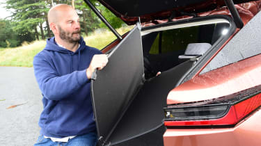 Auto Express creative director Darren Wilson loading the boot of our long–term Lexus RZ