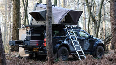 Isuzu D-Max Basecamp - pick-up parked with roof tent open, rear