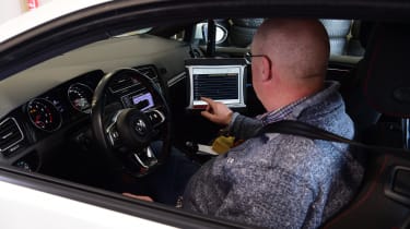 Auto Express products editor Kim Adams using an on-board tyre testing computer