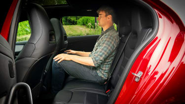 Auto Express staff writer Alastair Crooks sitting in the back seat of the Mercedes-AMG A35
