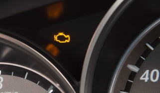 Engine management light showing on a Mazda 6&#039;s dashboard