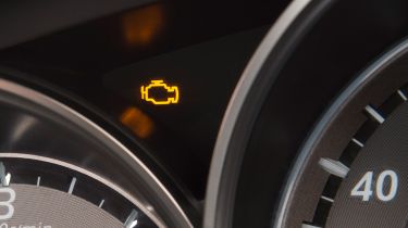 Engine management light showing on a Mazda 6&#039;s dashboard