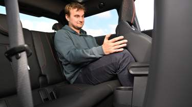 Auto Express senior news reporter Alastair Crooks sitting in the MINI Cooper JCW's rear seat