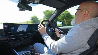 Auto Express senior test editor Dean Gibson driving the BMW M4 Competition