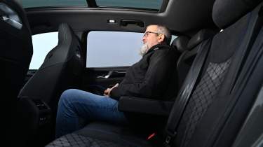 Auto Express senior test editor Dean Gibson sitting in the Volkswagen Tiguan&#039;s back seat 