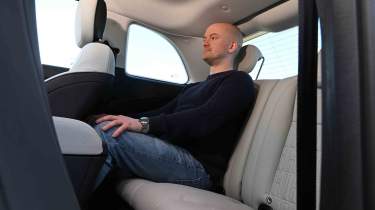 Fiat 500e - rear seats with Chief reviewer, Alex Ingram