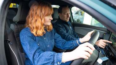 Auto Express pictures editor Dawn Grant and Renault sales executive Jamie Collis sitting inside the Renault 4