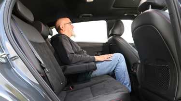 Auto Express senior test editor Dean Gibson sitting in the Hyundai Kona Hybrid's rear seat