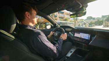 Alastair Crooks driving the Peugeot E-408 facelift