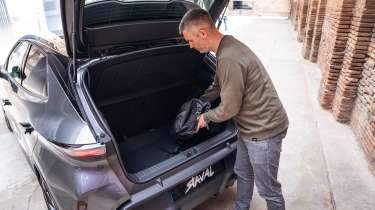 Auto Express deputy editor Richard Ingram loading the Cupra Raval's boot