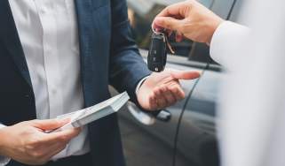 Car keys changing hands