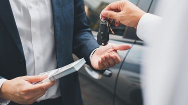 Car keys changing hands