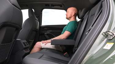 Auto Express former chief reviewer Alex Ingram sitting in the Audi Q5's rear seat