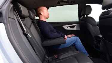 Auto Express chief reviewer Alex Ingram sitting in the Audi Q8&#039;s back seat