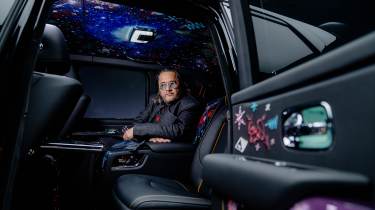 Cyril Kongo sitting in the rear of the Rolls-Royce Black Badge Cullinan by Cyril Kongo