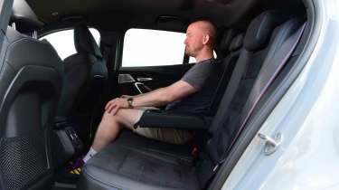 BMW iX2 - rear seats with Chief reviewer, Alex Ingram