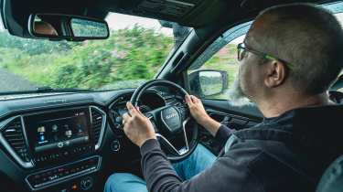 Auto Express senior road test editor Dean Gibson driving the Isuzu D-Max Mudmaster