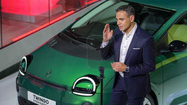 Twingo - executive talking in front of car