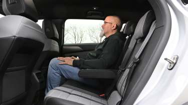 Vauxhall Grandland Hybird - rear seats being sat in by Auto Express senior test editor Dean Gibson