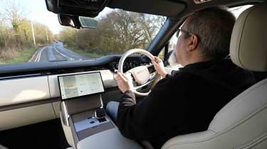 Range Rover - interior driving image with Senior test editor, Dean Gibson