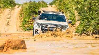 Isuzu D-Max Mudmaster - driving through muddy water (front)